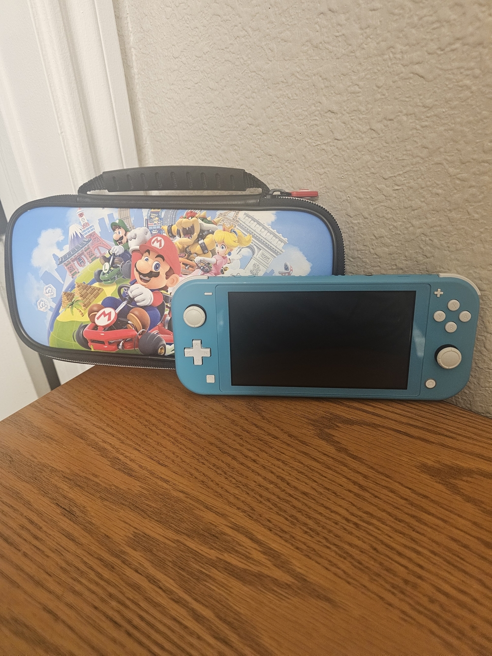 Nintendo Switch Lite (Blue) + Mario Kart Carrying Case